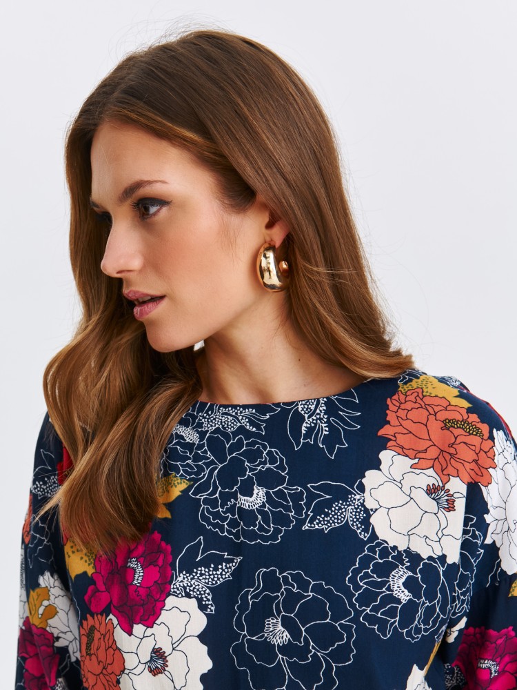 Bluzka damska w kwiaty z wiązaniem na dole Bluzka damska w kwiaty z wiązaniem na dole