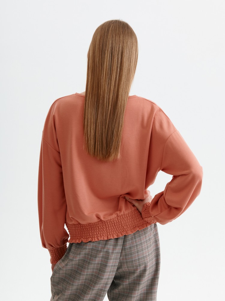 Krótka bluza zakończona szerokim ściągaczem