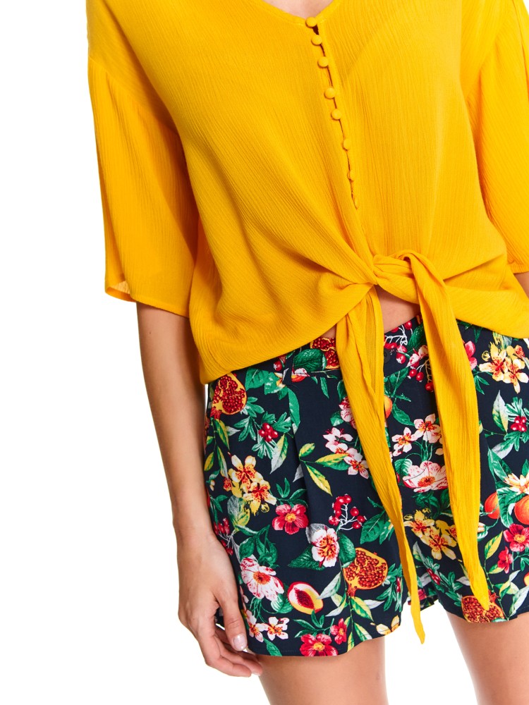 Luźna koszula wiązana na dole