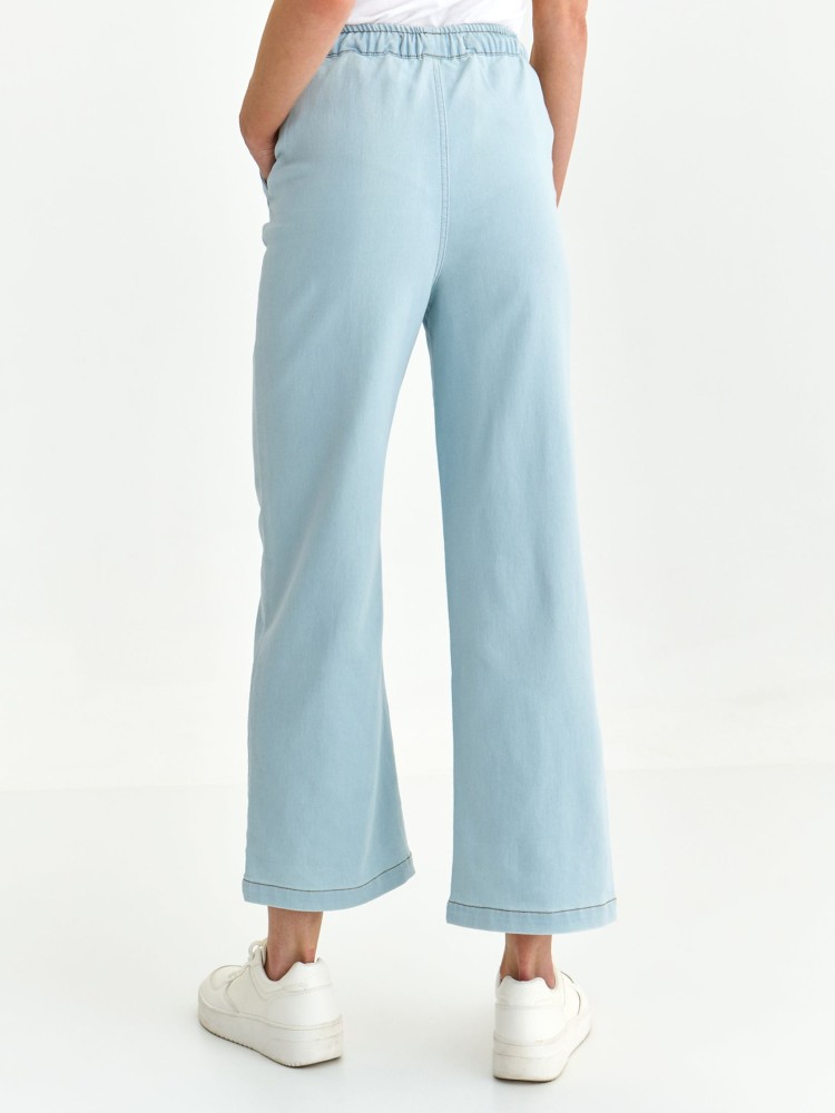 Gładkie spodnie z rozszerzaną nogawką i gumą w pasie