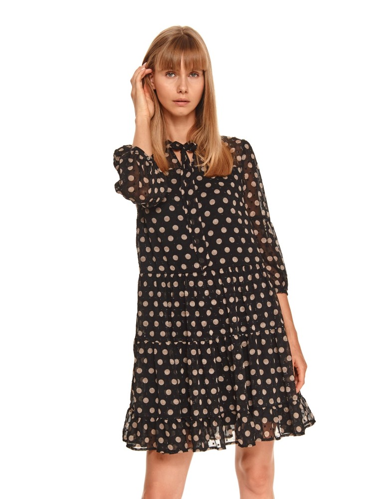 Sukienka w grochy z wiązaniem pod szyją i falbaną