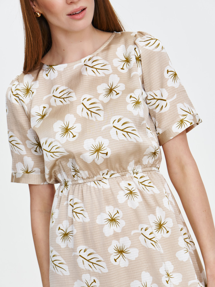 Beżowa sukienka w jasne kwiaty  Beżowa sukienka w jasne kwiaty