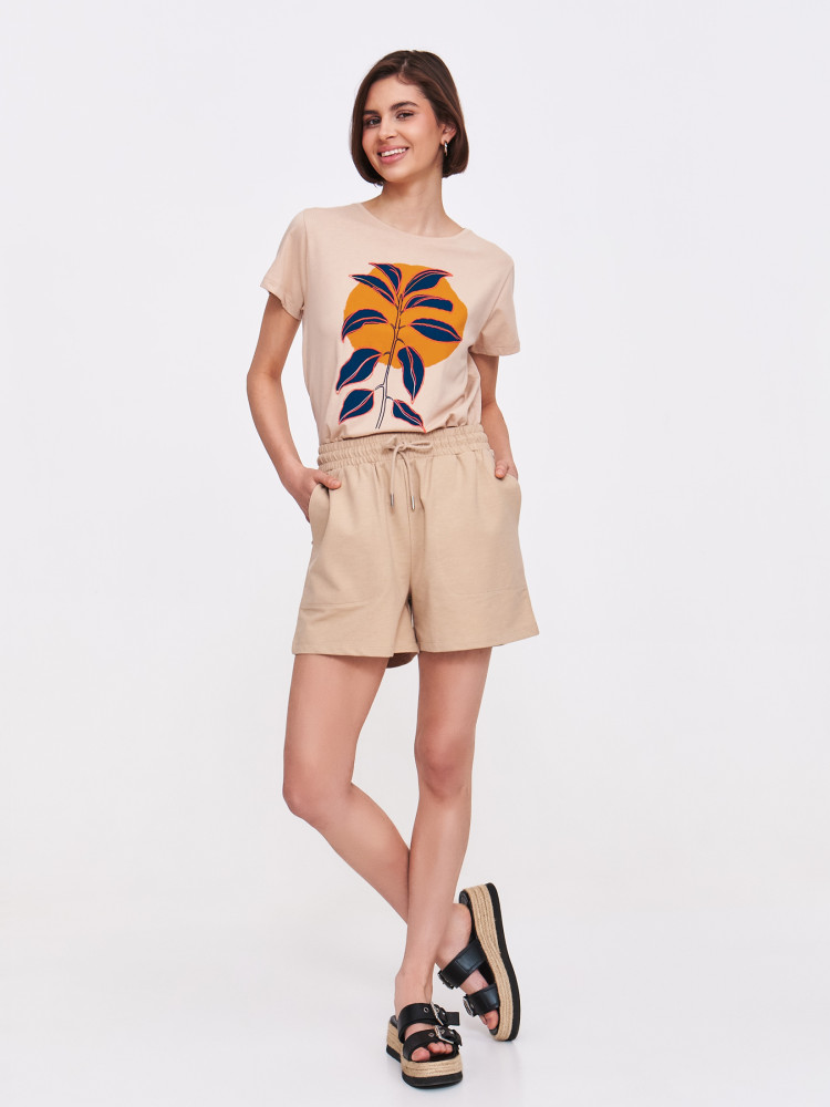 Beżowy top z grafiką