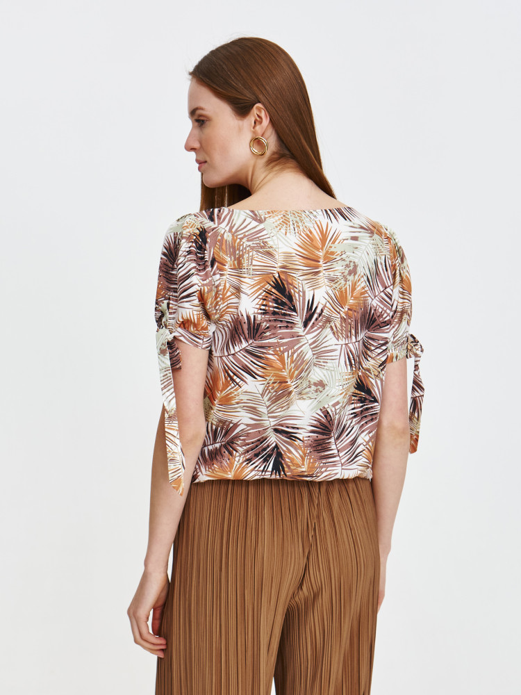 Bluzka z tropikalnym printem w kolorze beżowym 