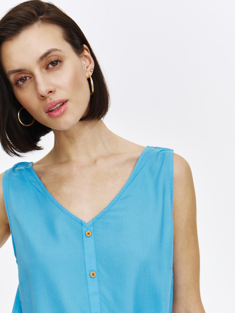 Niebieska bluzka z wiązaniem u dołu 