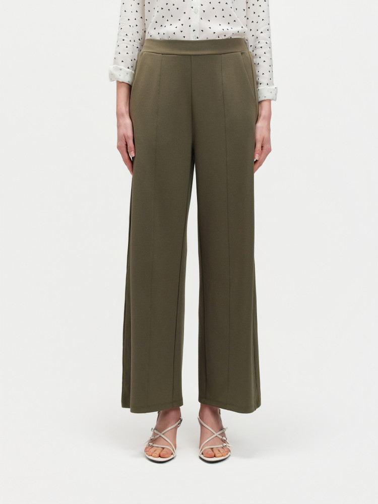 Zielone spodnie z nogawką w kant 