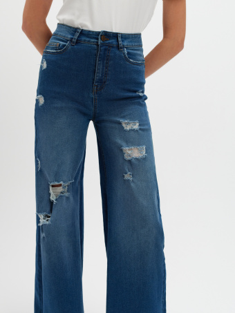 Granatowe jeansy wide leg z przetarciami 