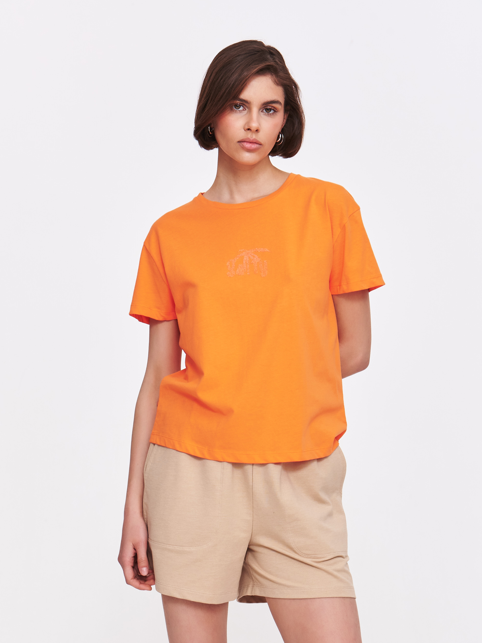 Pomarańczowy top z wytłaczaną grafiką 