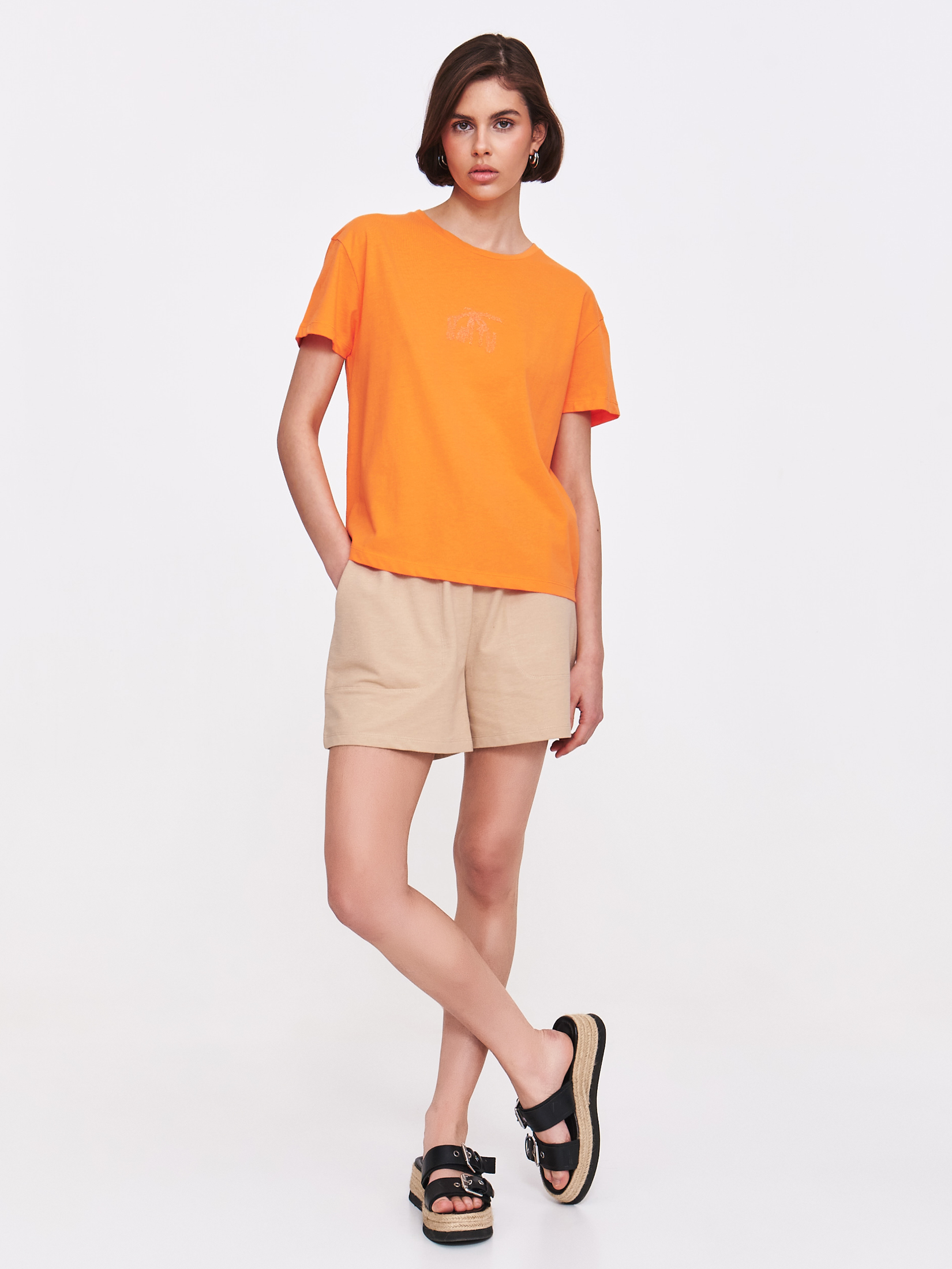 Pomarańczowy top z wytłaczaną grafiką 
